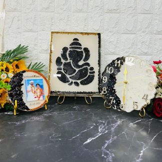 9x12 inch Ganesh frame with varmala, 6 inch resin couple frame with garland, 8 inch curved clock with garland