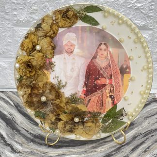 10-inch round deep casting frame with preserved yellow varmala flowers, wedding picture, and white pearls