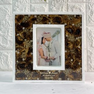 14-inch double teakwood resin frame with preserved wedding garland and couple’s photo