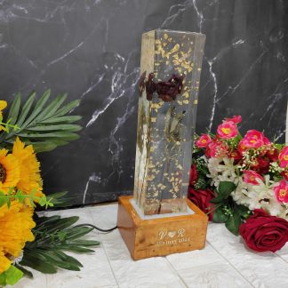 Rectangular crystal clear resin LED block with single rose preservation